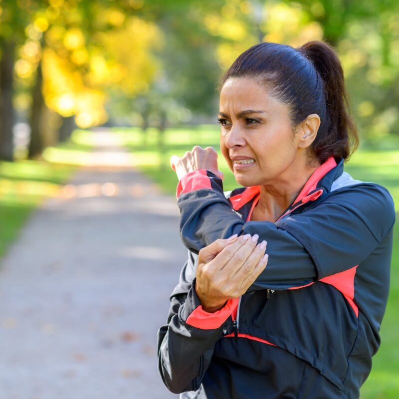 Woman with tennis elbow pain in Modesto, CA