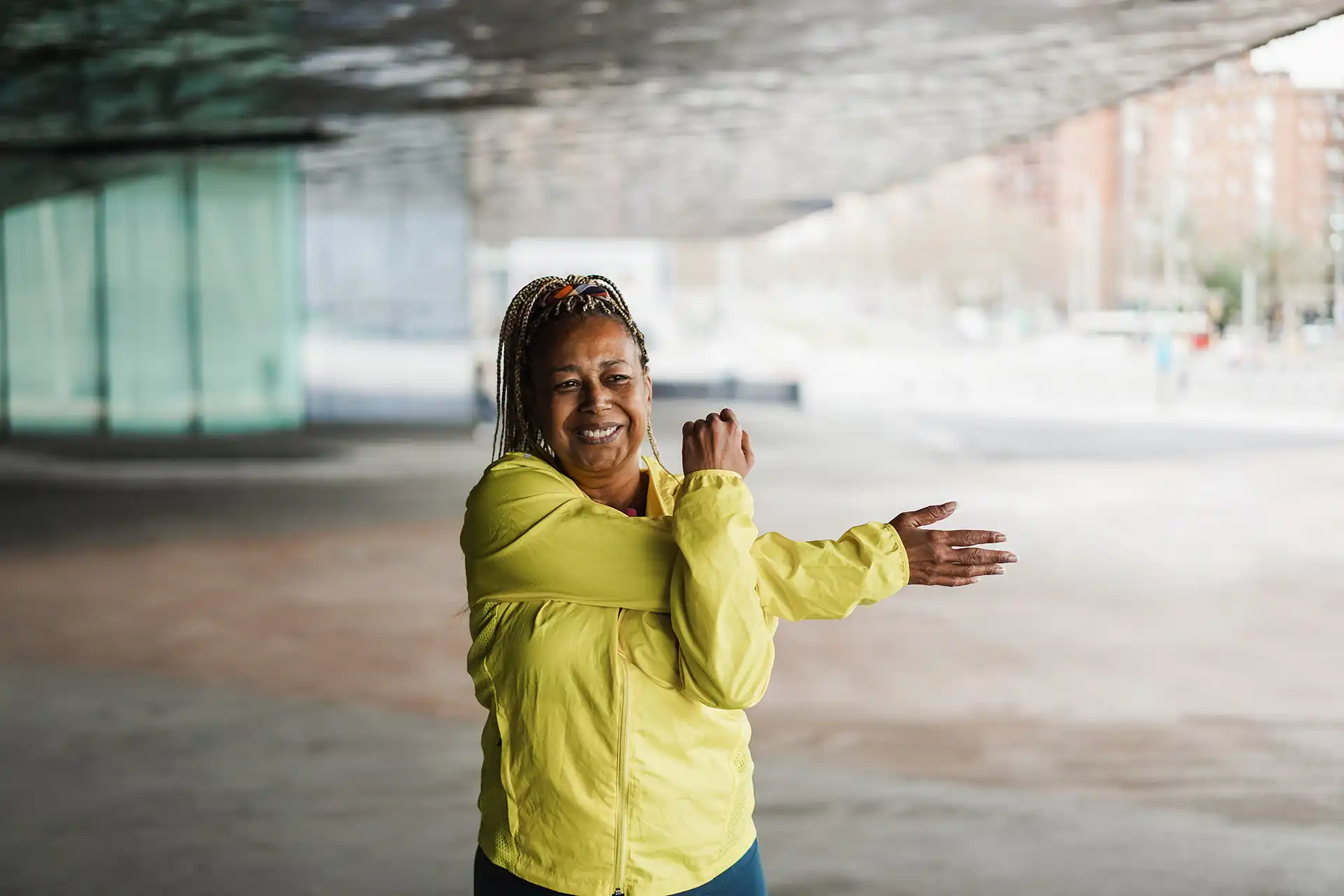 Woman stretching after being fully recovered from Reverse Shoulder Replaceemnt. What Happens to Rotator Cuff Muscles After Reverse Shoulder Replacement Surgery?