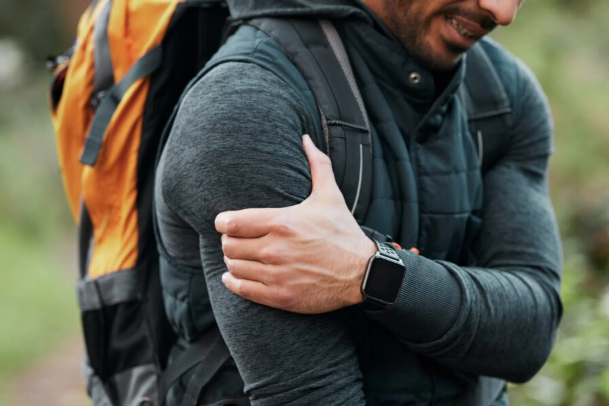 Man holding shoulder