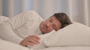 adult man sleeping on his side